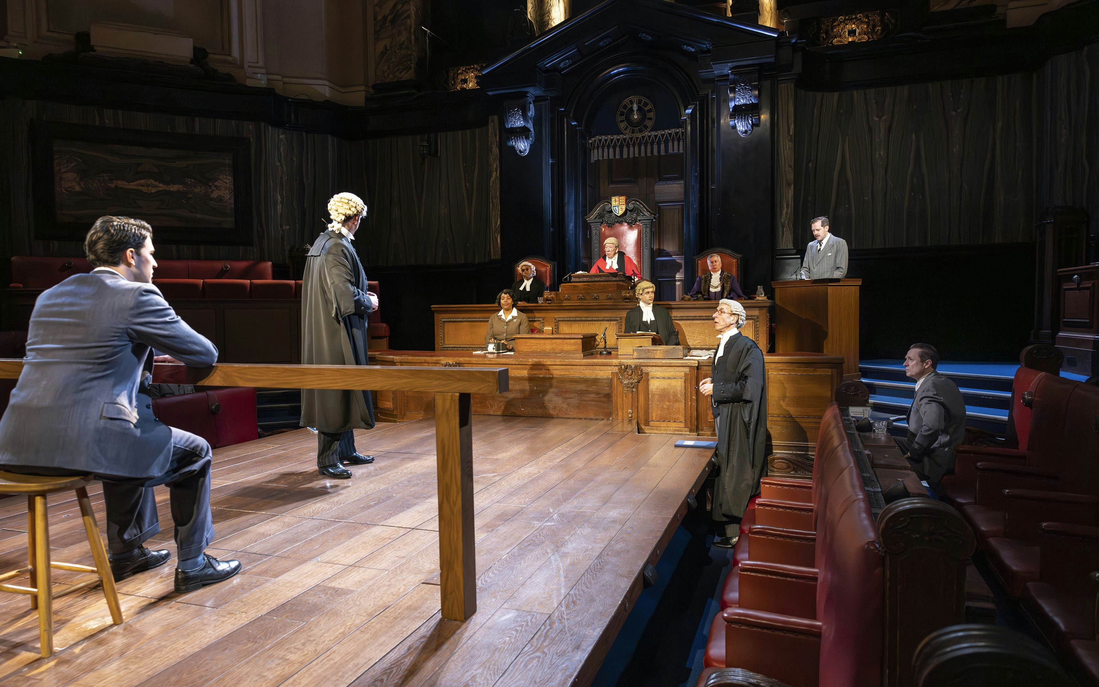 Courtroom scene from "Witness for the Prosecution" performance with actors in legal attire.