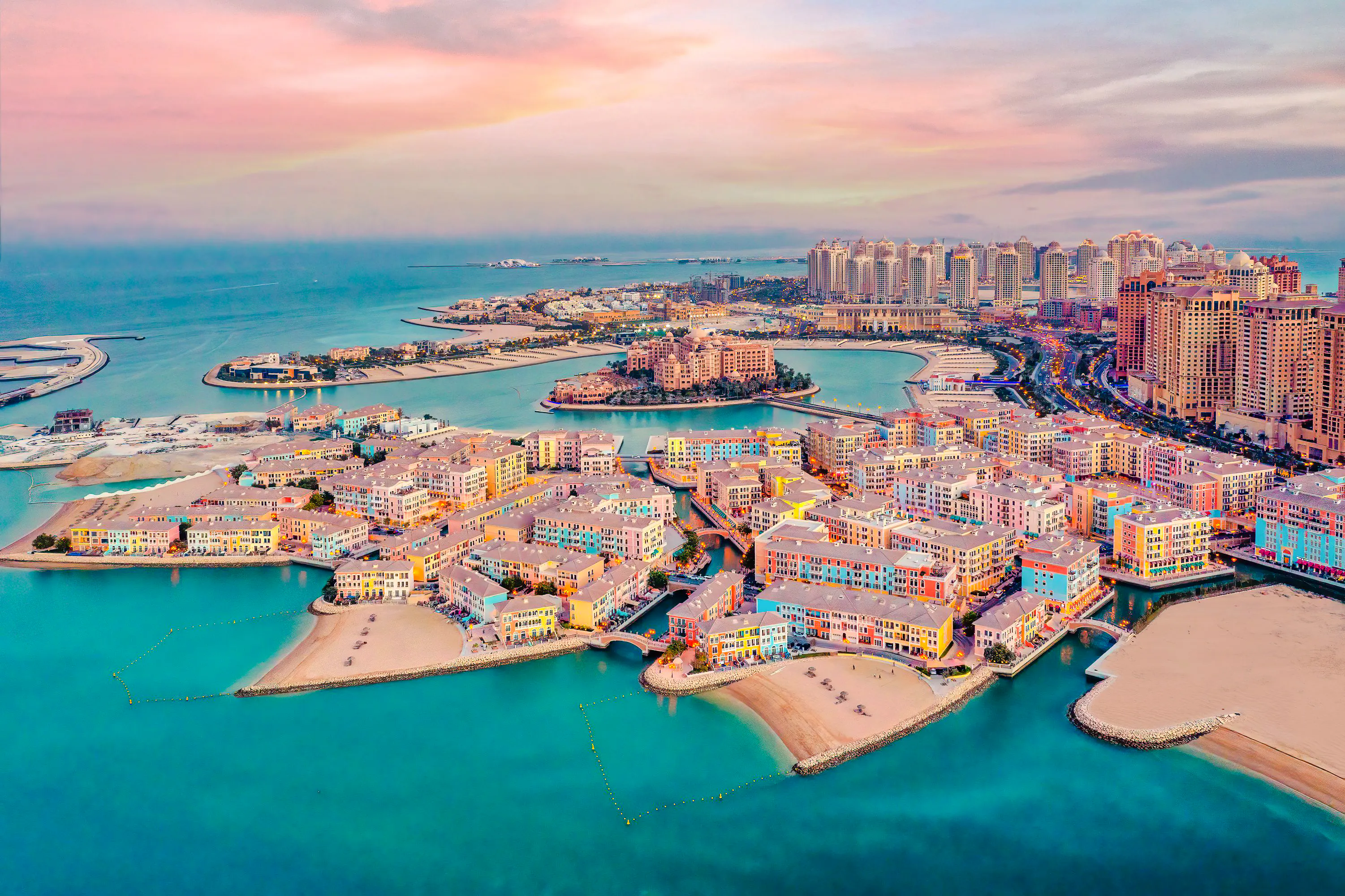 Aerial view of The Pearl-Qatar island with colorful buildings and waterfront, Doha.