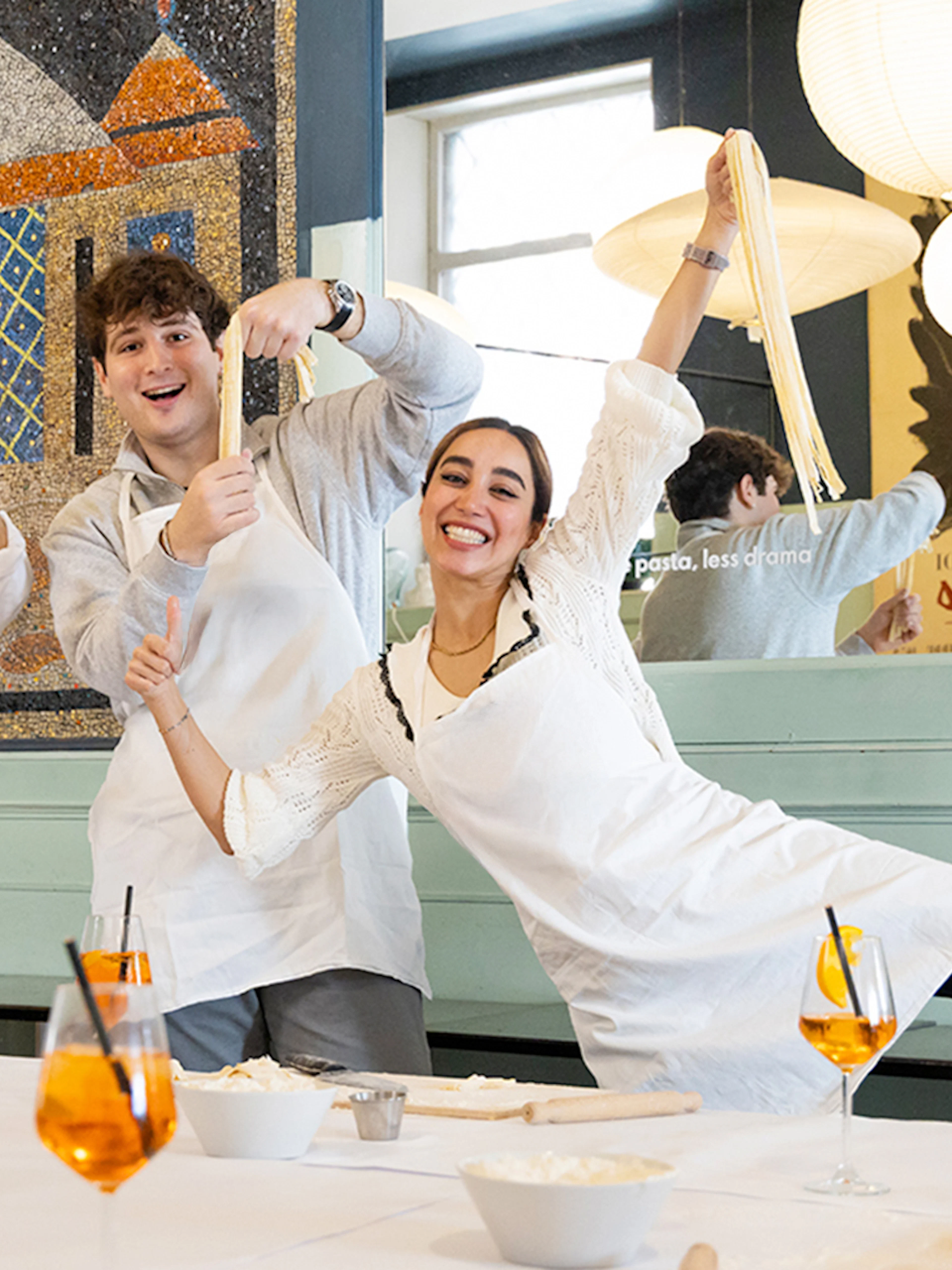 Participants making pasta in a Rome cooking class.