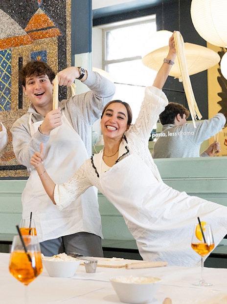 Participants making pasta in a Rome cooking class.