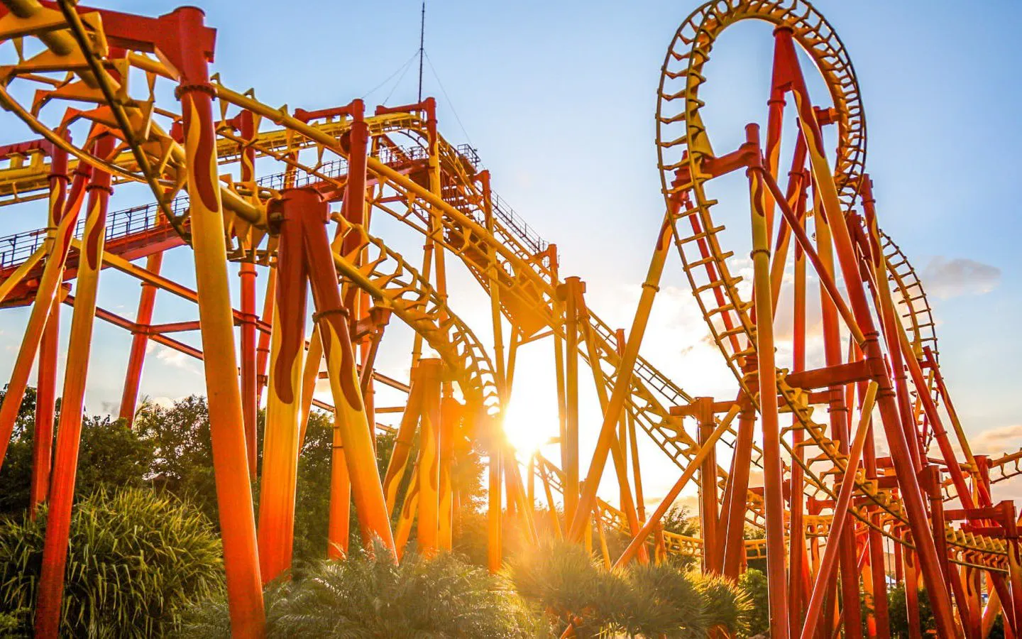 Roller coaster tracks at Montanha-Rusa Beto Carrero with sunset in the background.
