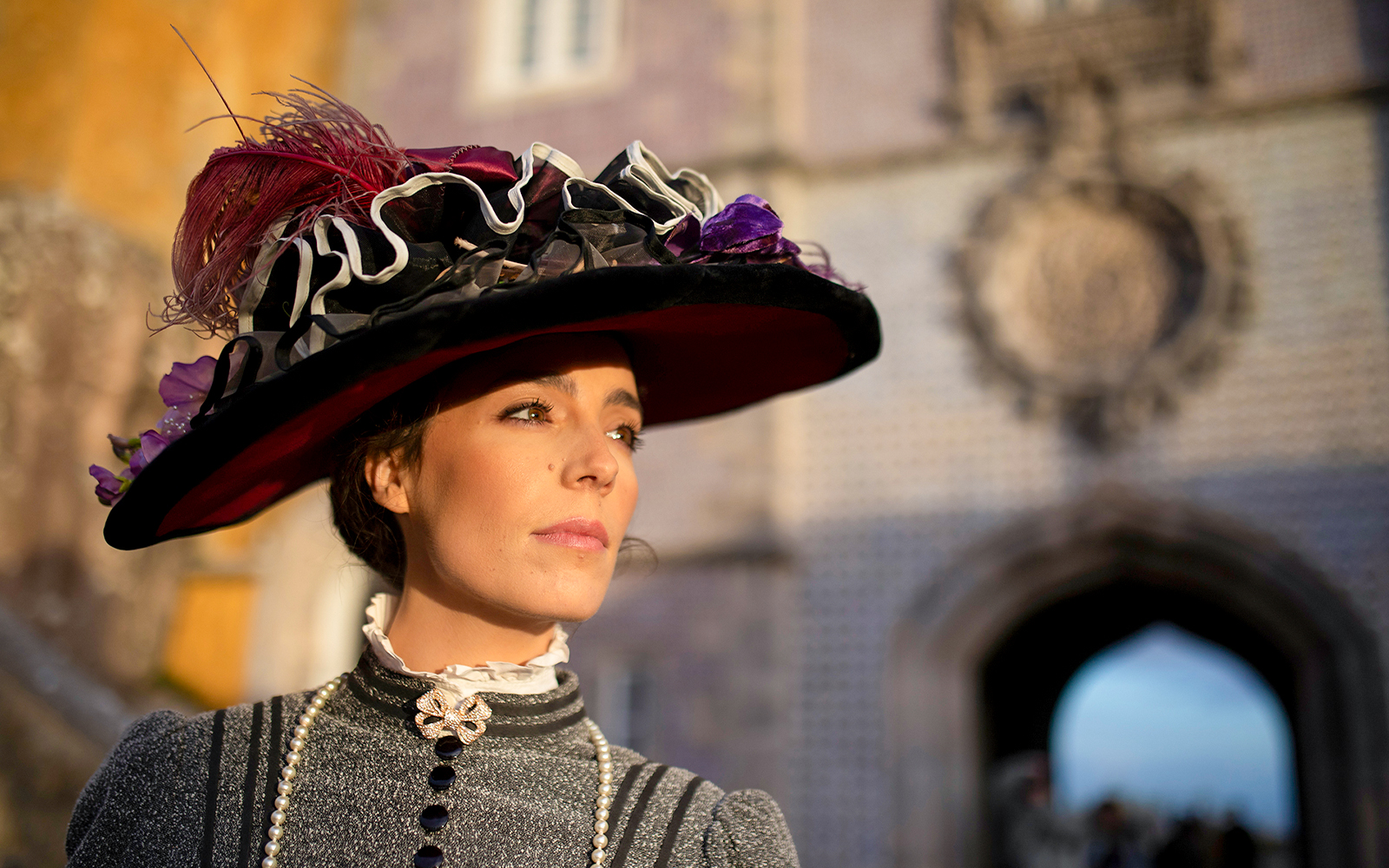 Woman in period costume at Palace of Pena, Sintra, Portugal, for theatrical tour.