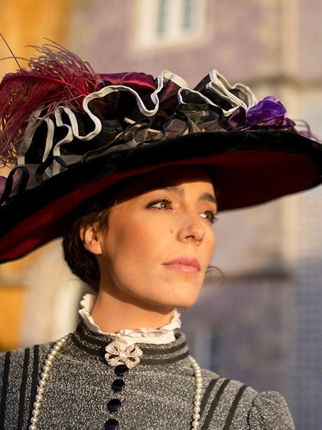 Woman in period costume at Palace of Pena, Sintra, Portugal, for theatrical tour.