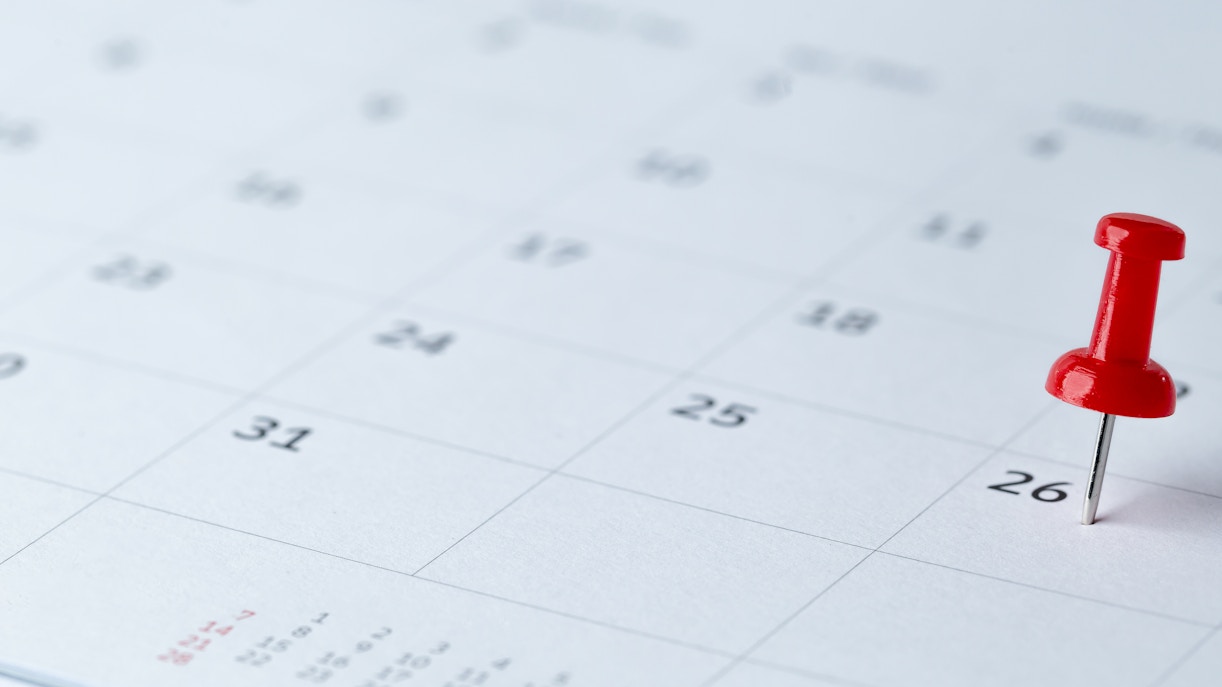 Calendar page with red pushpin marking the 26th.