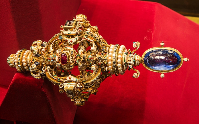 Ornate jeweled scepter with pearls and gemstones at Imperial Treasury Vienna.