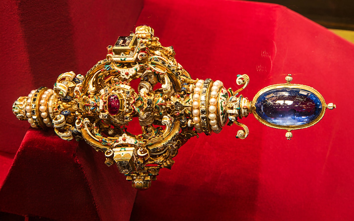 Ornate jeweled scepter with pearls and gemstones at Imperial Treasury Vienna.