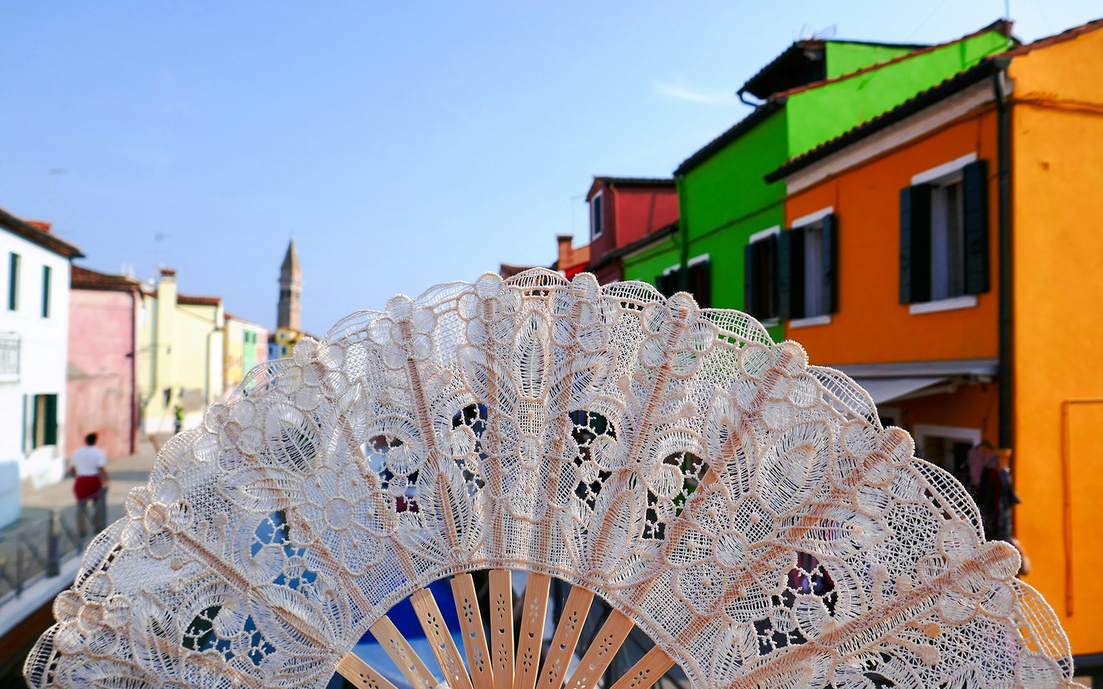 Lace fan with colorful houses in Burano, Venice.