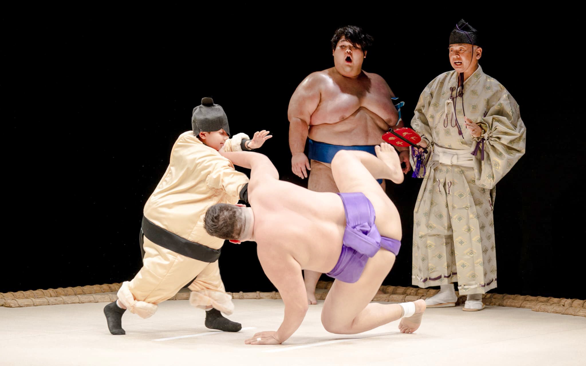 Sumo wrestlers practicing at Sumo Hall Hirakuzu during training experience.