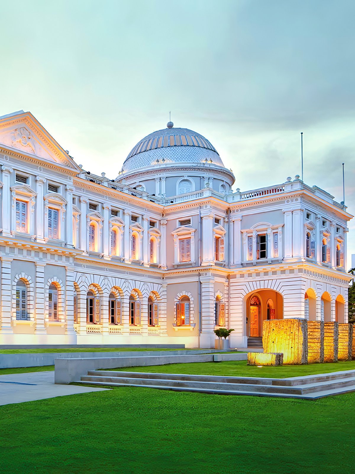 National Museum of Singapore exterior with illuminated facade at dusk.