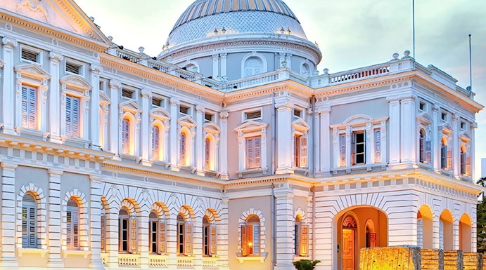National Museum of Singapore exterior with illuminated facade at dusk.