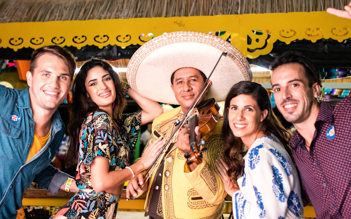 Guests enjoying live mariachi music at Xoximilco Park.