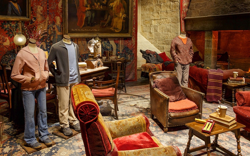 Gryffindor common room set with costumes from The Making of Harry Potter tour.