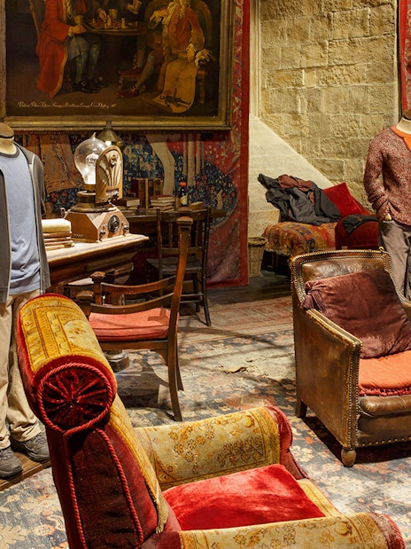 Gryffindor common room set with costumes from The Making of Harry Potter tour.