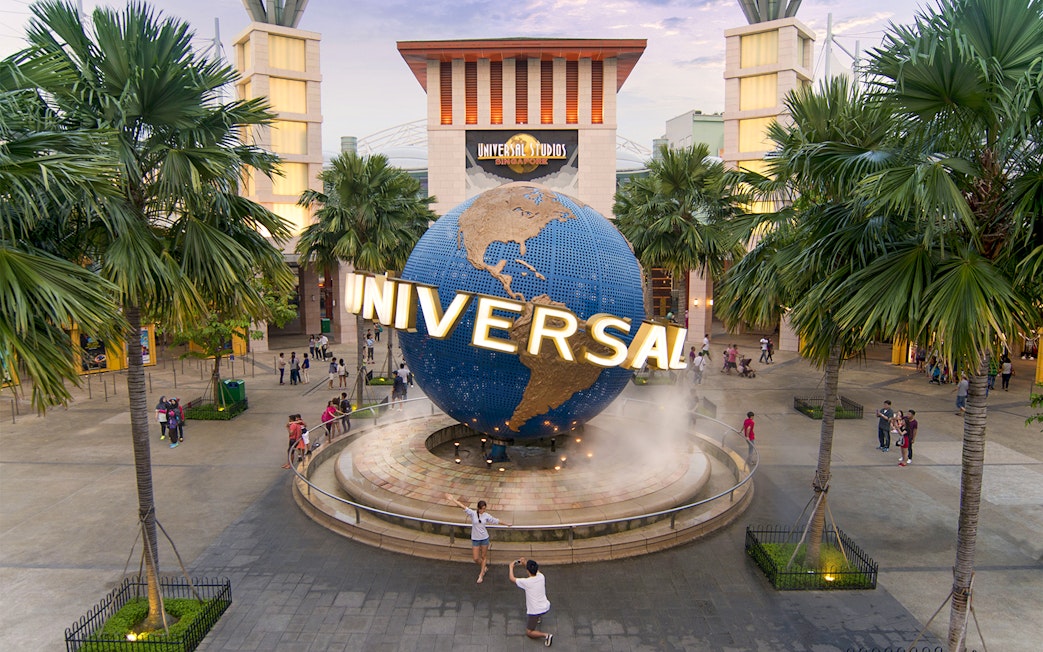 Universal Studios Singapore entrance with globe sculpture, part of Go City Singapore Pass.