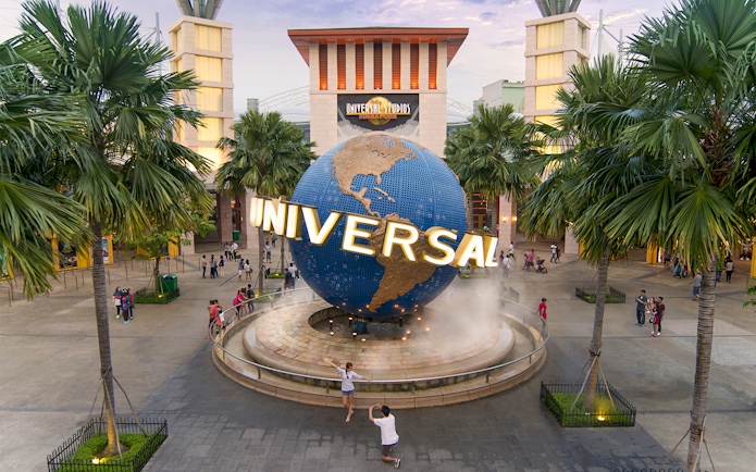 Universal Studios Singapore entrance with globe sculpture, part of Go City Singapore Pass.