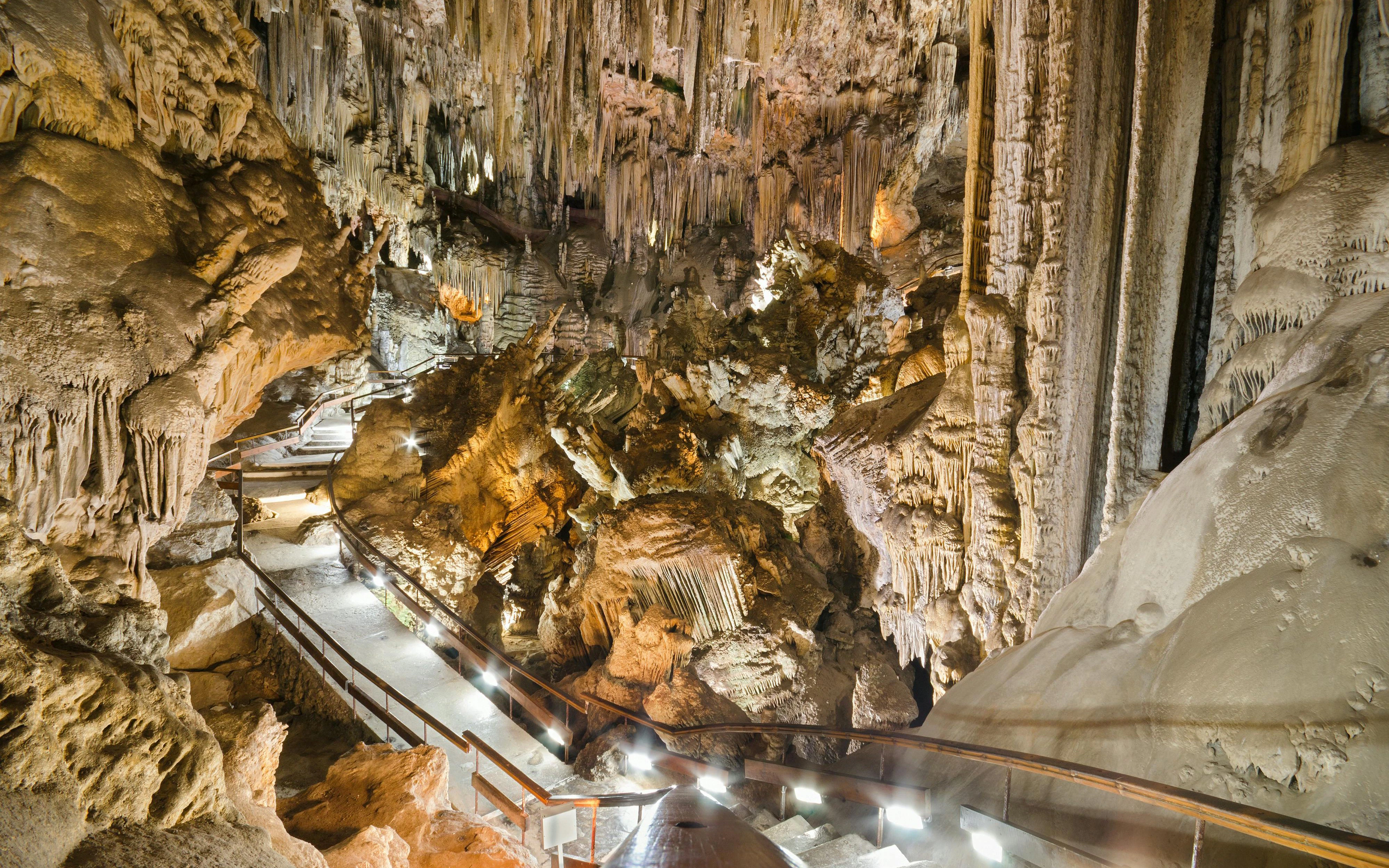 Walkway through stalactites and stalagmites in the Caves of Nerja, Spain.