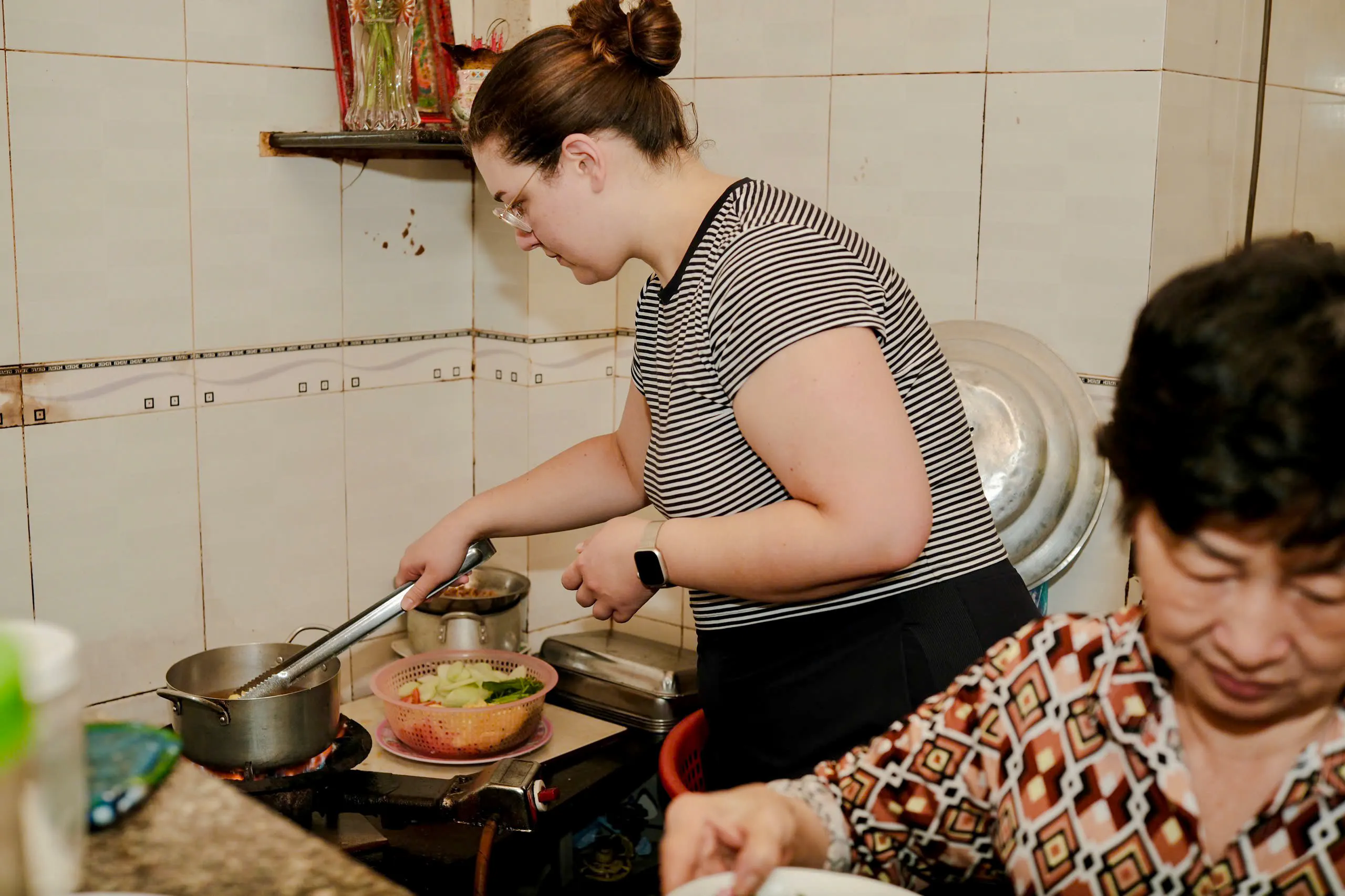 Cooking class participant preparing food at Auntie Home in Saigon, Ho Chi Minh City.