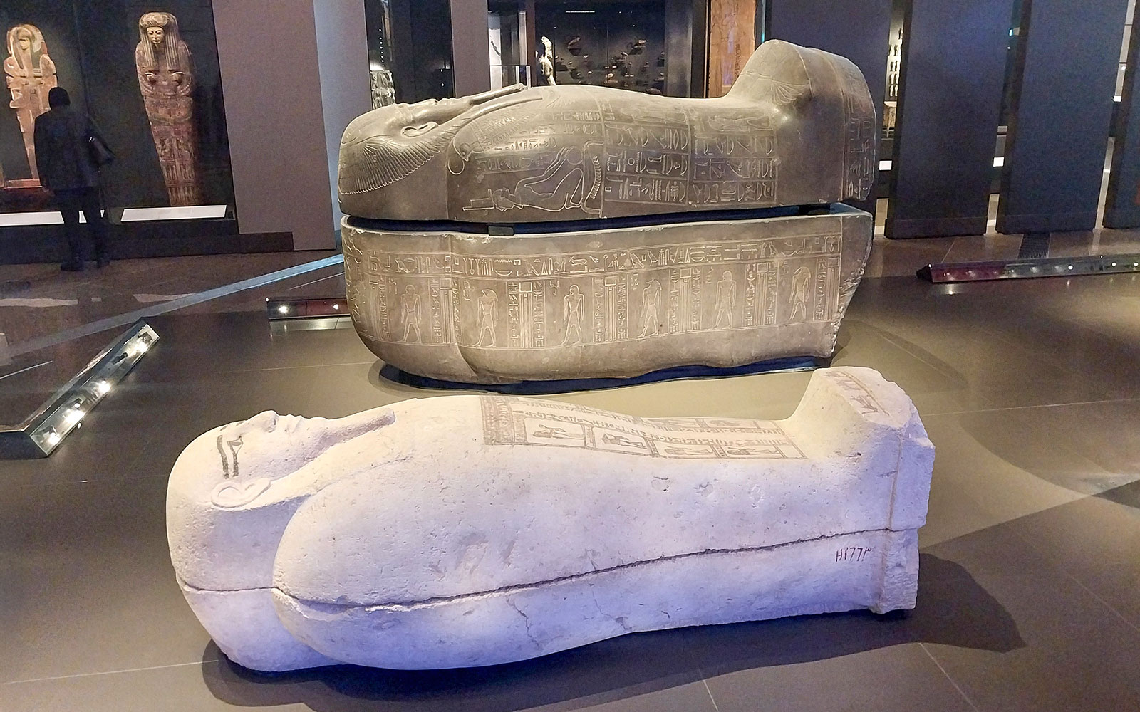 Ancient Egyptian sarcophagi displayed at the Grand Egyptian Museum.