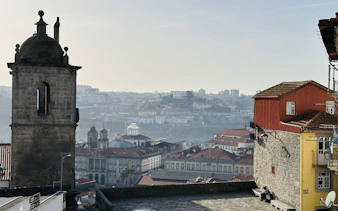 View from Porto Cathedral overlooking city rooftops and distant hills.