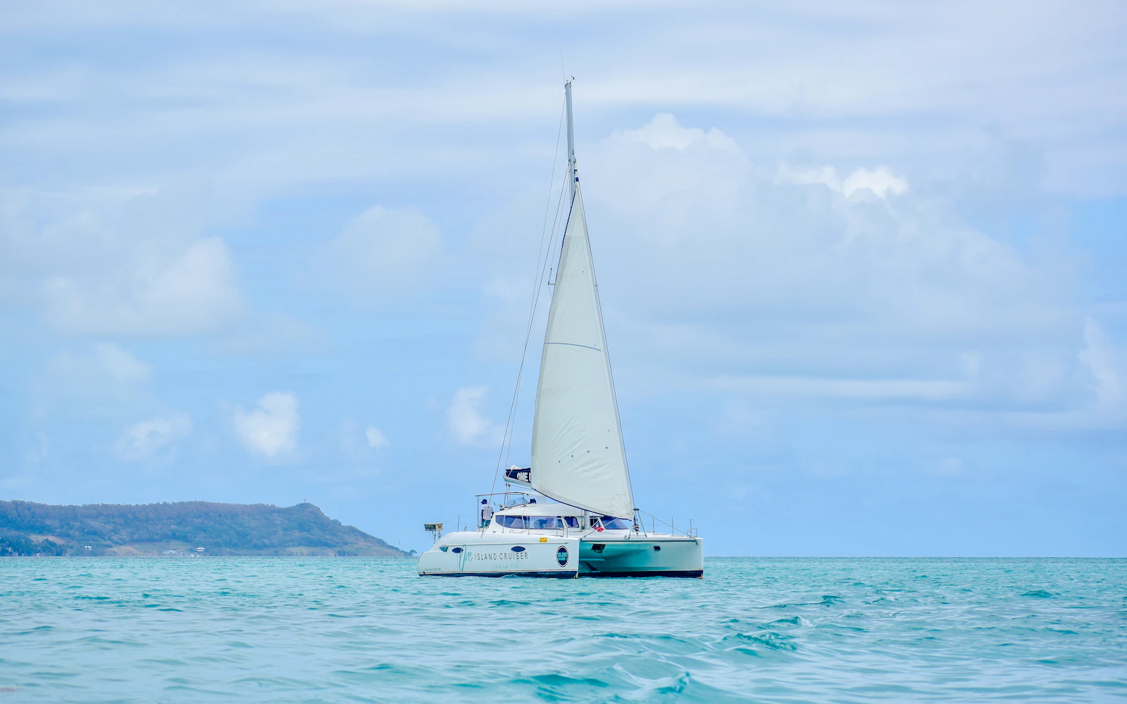 Catamaran Cruise to Ile aux Cerfs with Parasailing, Tube Riding, Lunch & Drinks