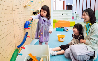 Children engaging with interactive exhibit at Miraikan, Tokyo.