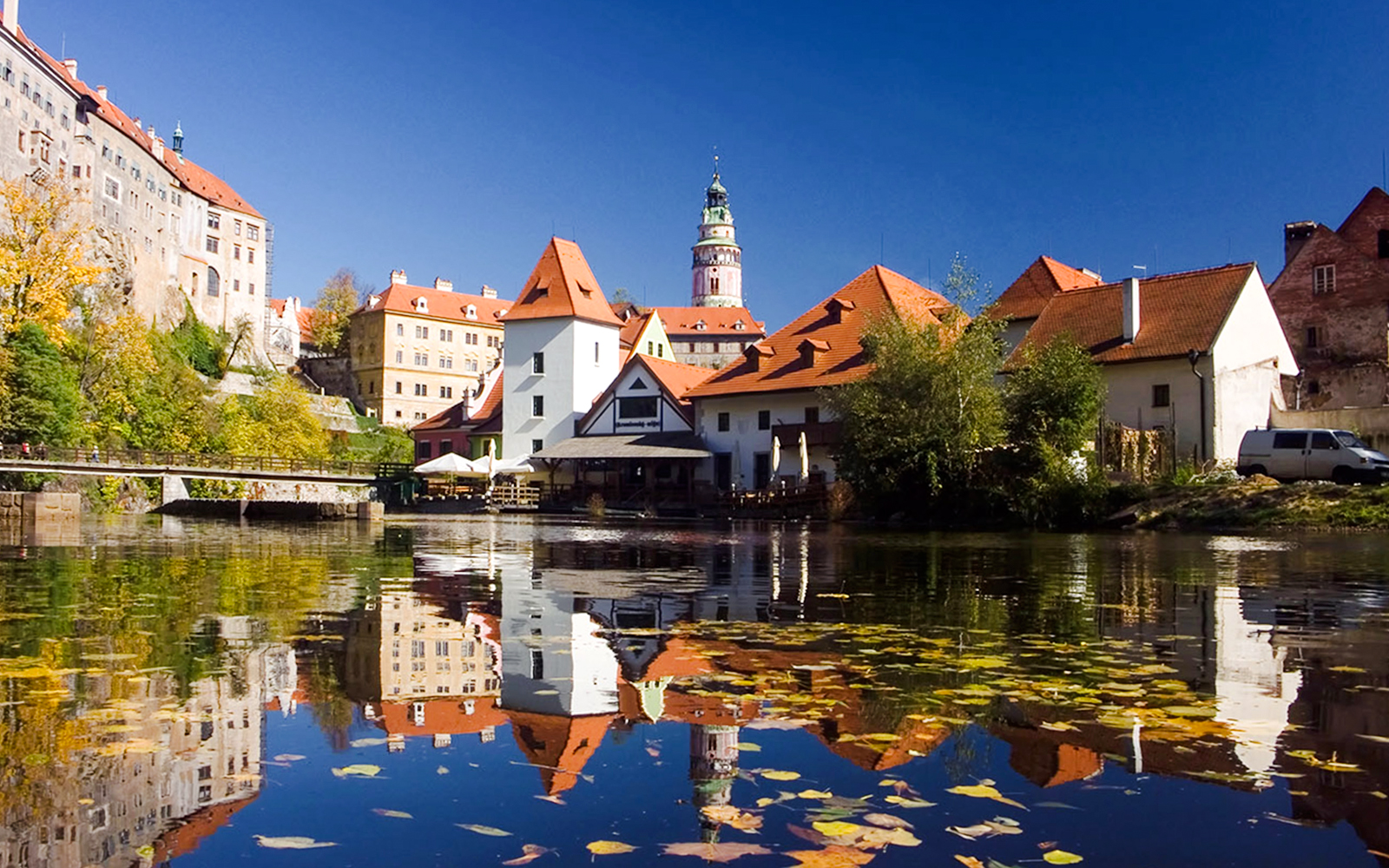 Historic buildings reflected in the Vltava River, Český Krumlov, Czech Republic.