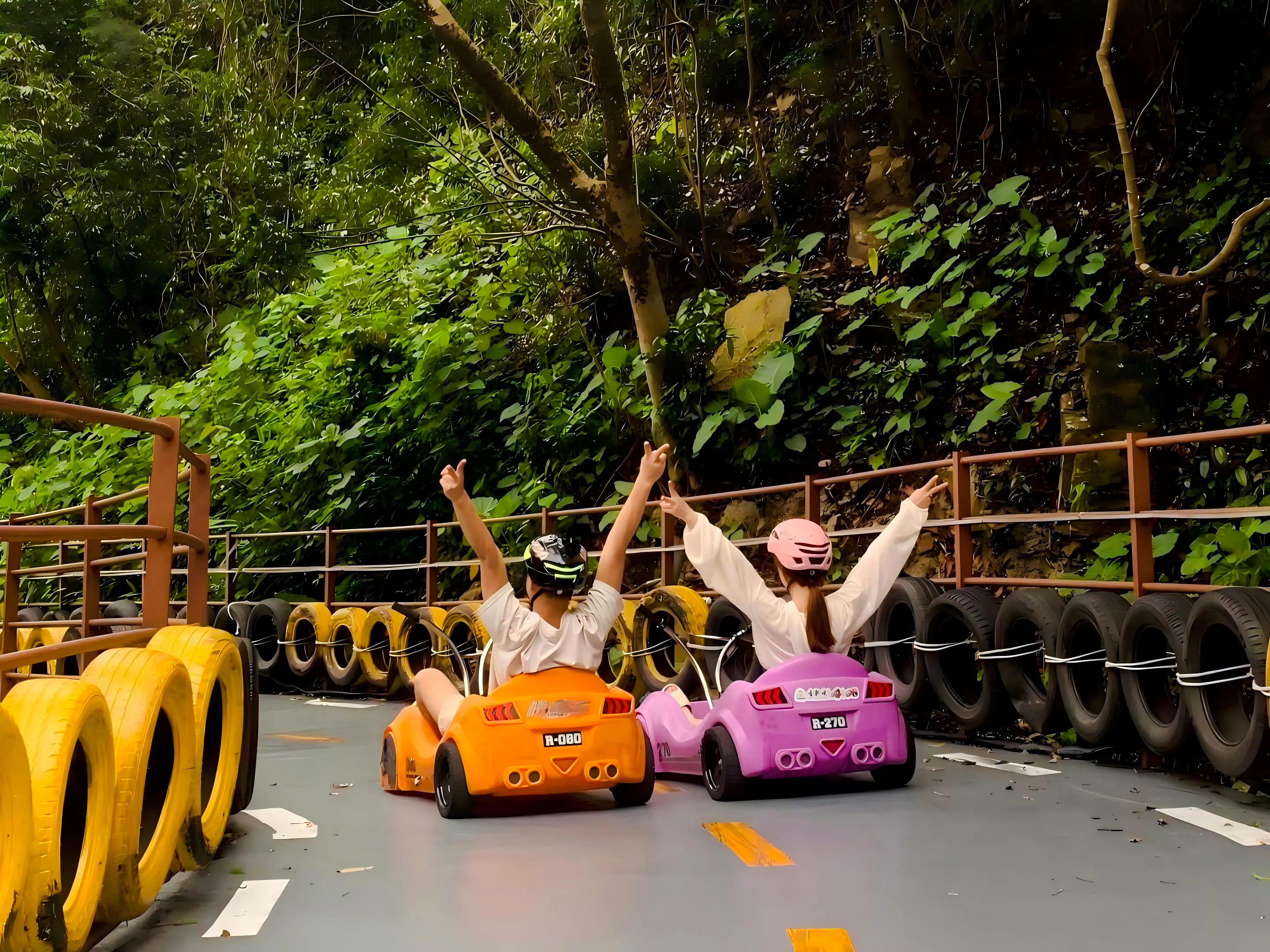 Go-karting on a scenic track surrounded by lush greenery at Gulong Gorge, Guangzhou.