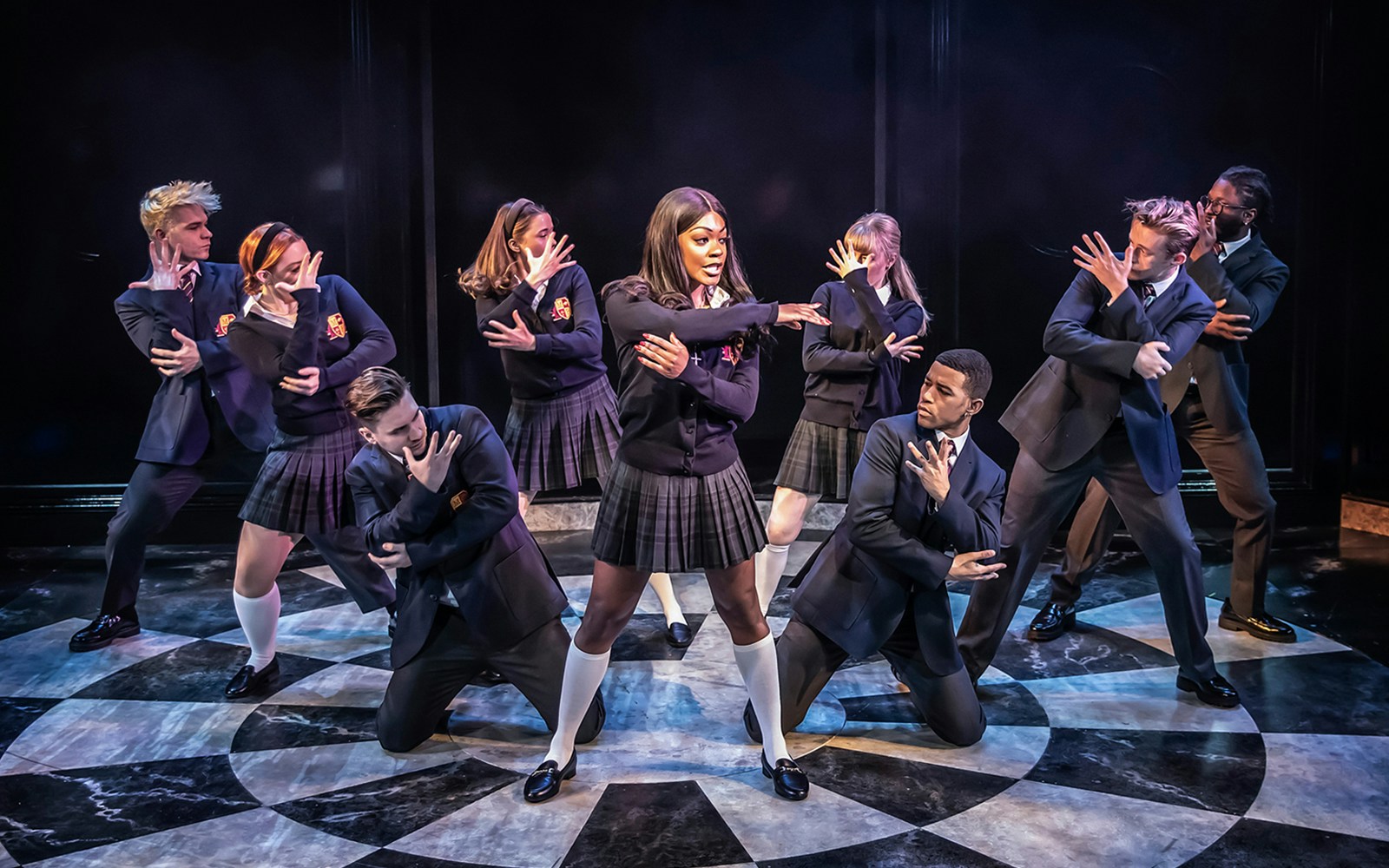 Performers in school uniforms dancing in Cruel Intentions: The 90's Musical.