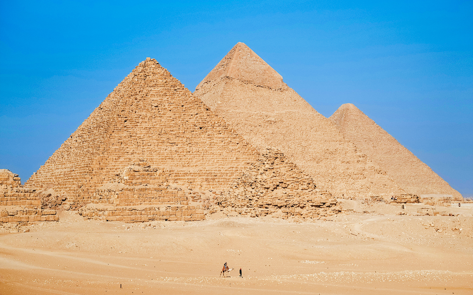 Pyramids of Giza under clear blue sky in Egypt.