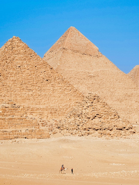 Pyramids of Giza under clear blue sky in Egypt.