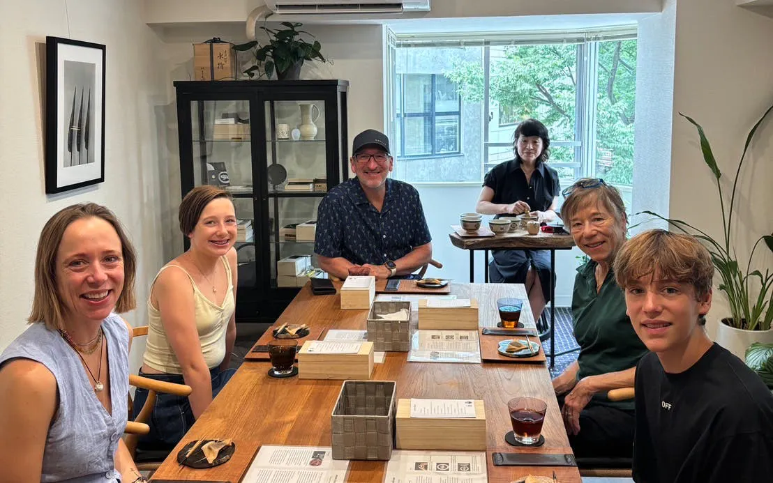 Small group enjoying Kintsugi workshop with matcha and sweets in Shibuya.