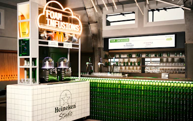 Heineken Experience bar with foam infusions display in Amsterdam.