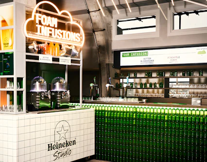 Heineken Experience bar with foam infusions display in Amsterdam.