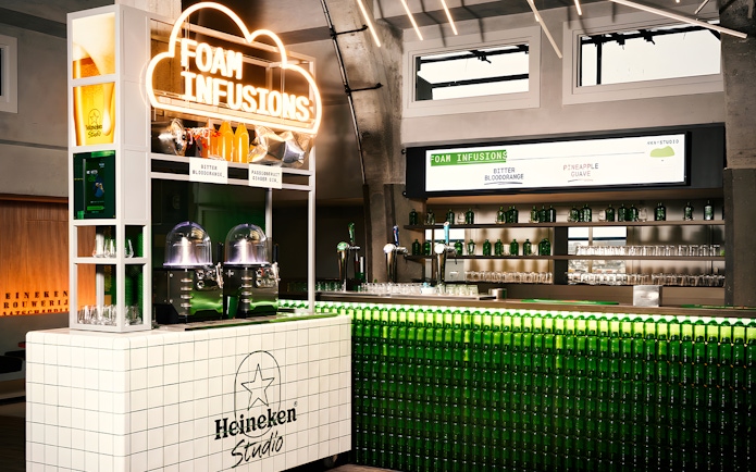 Heineken Experience bar with foam infusions display in Amsterdam.