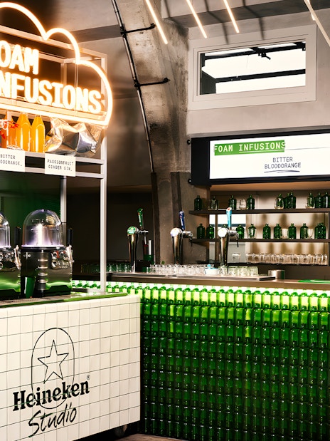 Heineken Experience bar with foam infusions display in Amsterdam.