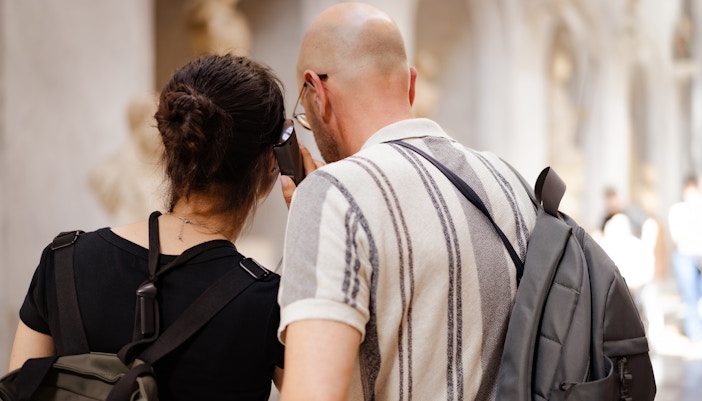 Guests using audio guide during museum visit