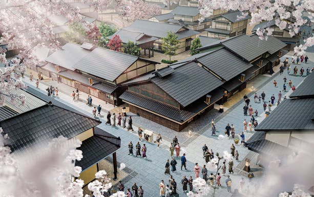 TOEI Kyoto Studio Park with visitors in traditional attire walking among historic buildings.