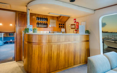 Luxury yacht interior bar area on Gold Coast whale watching tour.