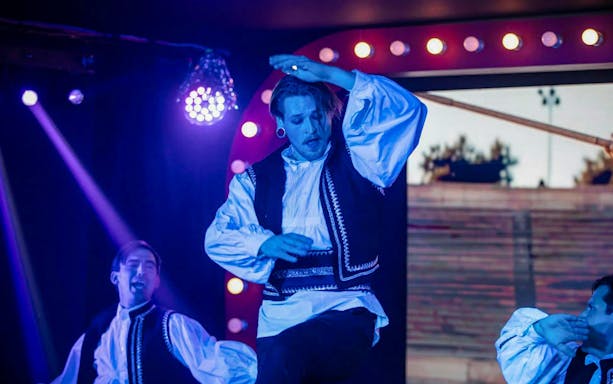 Performers in traditional attire at Cabaret & Burlesque Show, Voros Neon Theatre, Budapest.