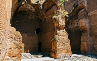Ancient brick walls and arches of the Roman Baths of Caracalla in Rome, Italy.