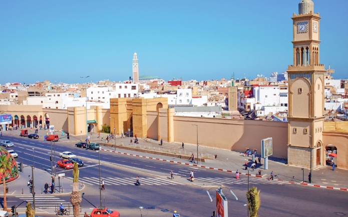 Old Medina street view with Hassan II Mosque in the background, Casablanca.