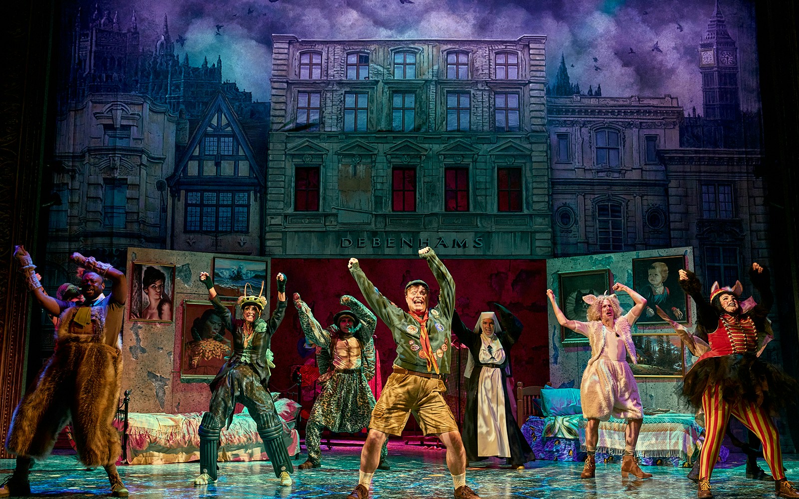 Mother Goose pantomime performance at London theater with actors in colorful costumes.