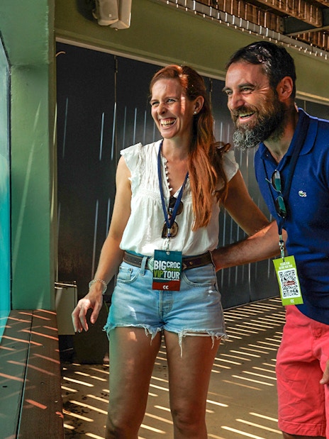 Couple enjoying crocodile view at Crocosaurus Cove, Darwin, Australia.