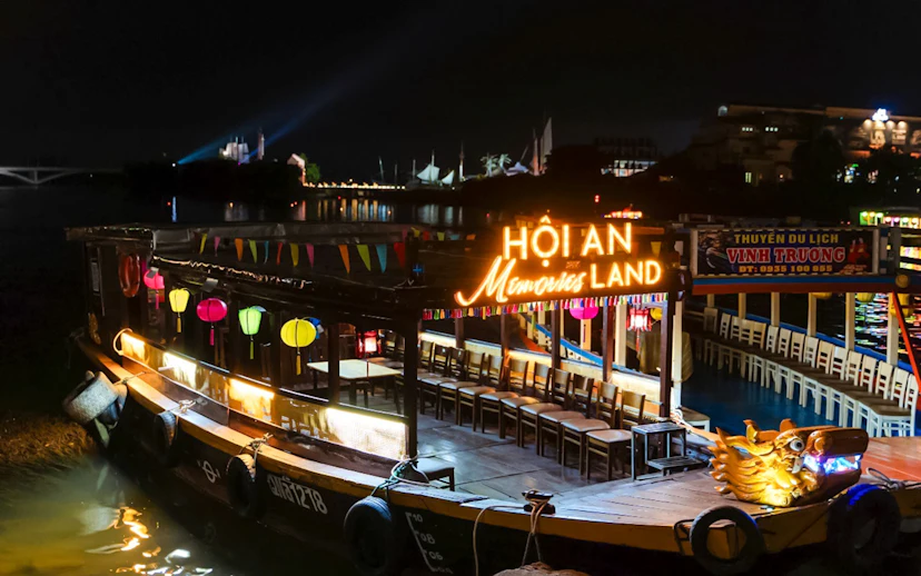 Hoi An Memories Land boat with colorful lanterns at night, Vietnam.