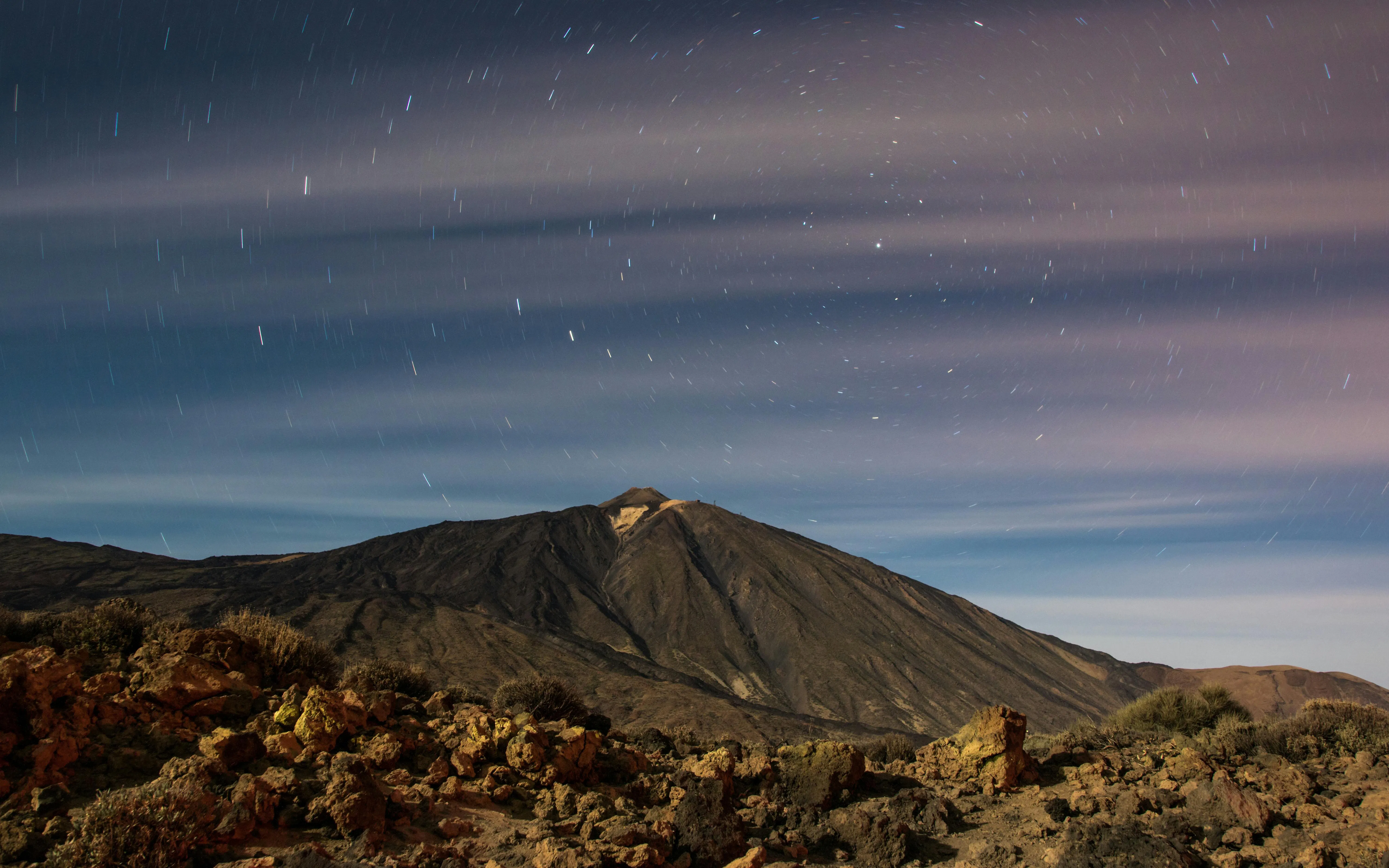 Teide volcano under a starry night sky in Tenerife.