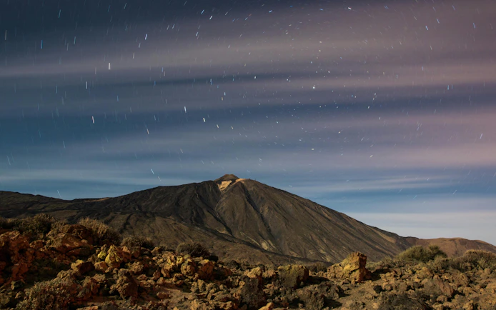 Teide volcano under a starry night sky in Tenerife.