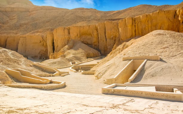 Valley of the Queens tomb entrances in Luxor desert landscape.