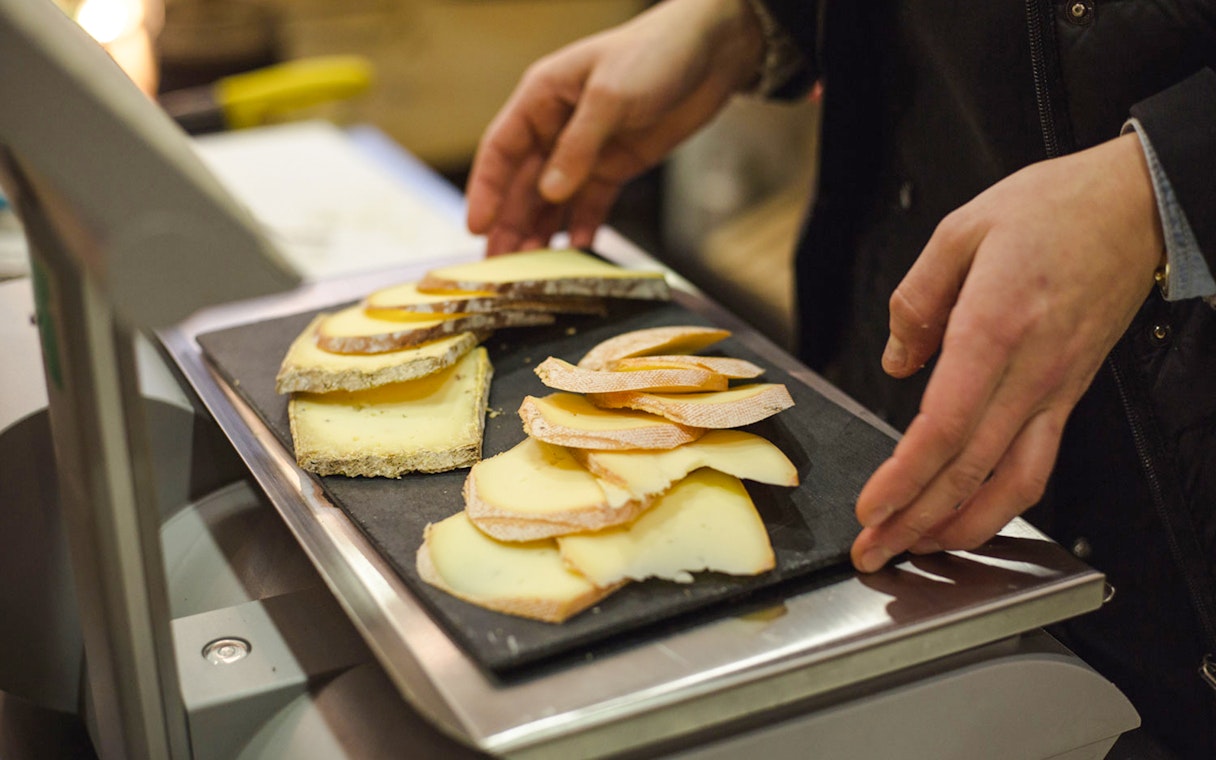 Cheese selection on tray at Paroles de Fromagers, Paris, France.