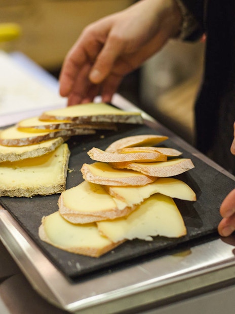 Cheese selection on tray at Paroles de Fromagers, Paris, France.