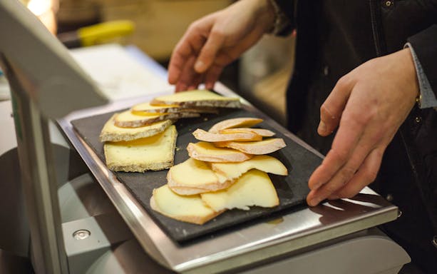 Cheese selection on tray at Paroles de Fromagers, Paris, France.